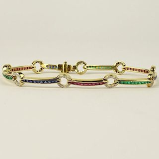 Lady's Diamond, Emerald, Ruby, Sapphire and 18 Karat Yellow Gold Bracelet.