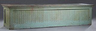 Large Polychromed Cypress Store Counter, late 19th c., the rectangular top over rear open storage, on a plinth base, in green paint, H.- 33 1/2 in., W