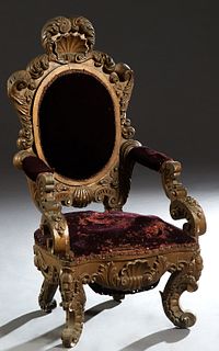 Highly Carved Gilt and Gesso Lady's or Child's Chair, c. 1900, the shell carved crest over an oval cushioned back with scrolled supports, to a cushion