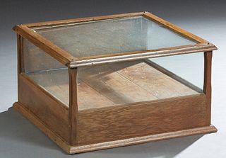 Small Carved Oak Table Top Display Case, c. 1910, with a glass top and three sides, the back with a hinged door, H.- 12 in., W.- 20 1/2 in., D.- 20 in