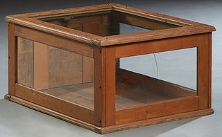 Small Carved Oak Table Top Display Case, early 20th c., with a glass top and three sides, the back with a fall front door, Note: One glass cracked, H.