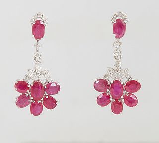 Pair of Platinum Pendant Earrings, each with an oval ruby mounted stud, suspending two diamond mounted links, to a floriform pendant with 6 oval rubie