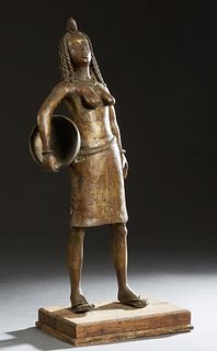 African Benin Bronze, "Standing Female with Bowl," 20th c., mounted on an integral wood base, H.- 29 in., W.- 12 in., D.- 9 in. Provenance: from the E