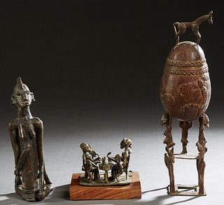Three African Benin Bronze Figures, 20th c., consisting of a ceremonial lidded vessel, Nigeria; a family at a table, on a paint decorated wooden base;