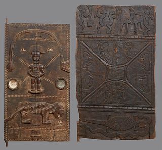 Two West African Carved Wood Granary Doors, early 20th c., with relief figural and animal decoration, H.- 54 in., W.- 31 in., H.- 48 in., W.- 26 1/4 i