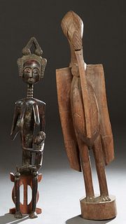 Two Large African Carved Wooden Figures, 20th c., one an ancestor carving of a female with a child on her knee, Mali; together with an ancestor figure