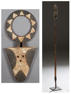 Two Carved Wood African Items, consisting of an Initiation Staff, with a female final, to a spear head tip, on an iron stand, West Africa; and a carve