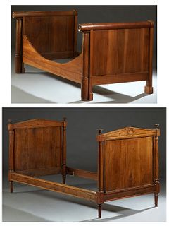 Two French Carved Walnut Daybeds, 19th c., one a Directoire style example, with peaked sleigh ends, flanked by turned finials, on tapered cylindrical 