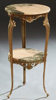 French Louis XV Style Bronze and Marble Two Tier Stand, early 20th c., the circular highly figured pink and grey marble over a pierced skirt to shaped