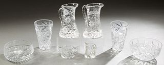 Group of Eight Pieces of Cut Crystal, 20th c., consisting of two large pitchers; two conical glass vases; a two piece cream and sugar set; and two cir