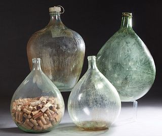 Four French Provincial Mold Blown Glass Wine Carboys, 19th c., two clear, one pale green and one olive green, Olive- H.- 22 1/2 in., Dia.- 15 in.