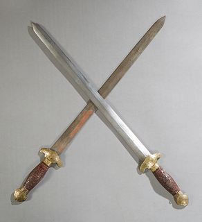 Unusual Wood, Brass and Steel Double Sword, 20th c., in a brass mounted faux tortoise scabbard, H.- 28 1/4 in., W.- 3 in., Dia.- 1 1/4 in.