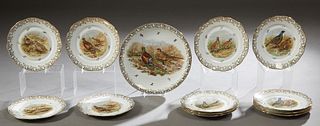 13 Piece Limoges Porcelain Game Set, 20th c., with gilt rims and tracery around transfer reserves of game birds, consisting of 12 plates and a platter