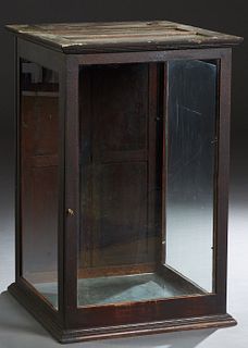 Carved Oak Tabletop Display Case, c. 1900, with a glass front, top and sides, the rear with double doors, H.- 39 in., W.- 25 in., D.- 25 in.