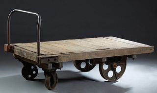 Iron and Oak Warehouse Cart, 19th c., from a New Orleans sugar cane warehouse, on large iron wheels, H.- 39 1/2 in., W.- 38 1/2 in., D.- 75 in.
