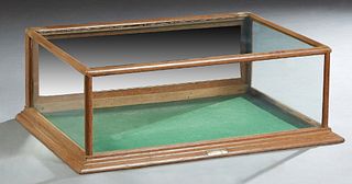 Carved Oak Tabletop Display Case, early 20th c., with a glass top and three sides, the back with a hinged drop door, H.- 12 1/2 in., W.- 36 1/2 in., D