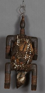 African Carved Wooden Power Figure, Congo, wrapped in rattan and cloth, with shell decoration, H.- 17 in., W.- 7 1/2 in., W.- 5 in. Provenance: from t