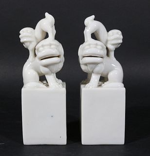 Pair of Blanc de Chine Seal-Form Models of Lions