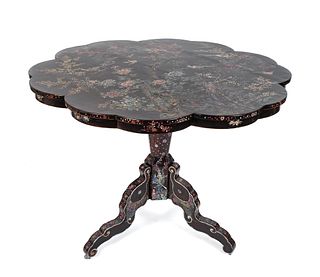A Japanese Nagasaki Export Lacquer Center Table
Height 32 1/4 x diameter 42 1/4 inches.