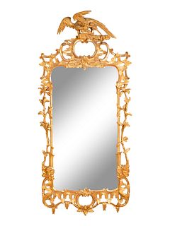 An Early Victorian Giltwood Mirror
Height 66 1/2 x width 29 1/2 inches.