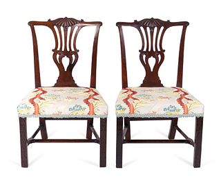 A Pair of George III Carved Mahogany Side Chairs Height 36 1/2 x width 22 1/2 inches.