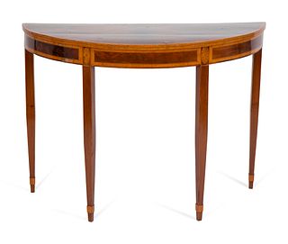 A George III Style Satinwood-Inlaid Mahogany Demilune Table
Height 34 x width 47 x depth 21 1/2 inches.