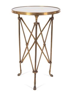 A Directoire Style Gilt Bronze and White Marble Gueridon
Height 26 3/4 x diameter 17 inches.