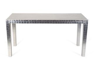 A Contemporary Silver Leaf Parsons- Style Console Table
Height 30 x width 40 inches.