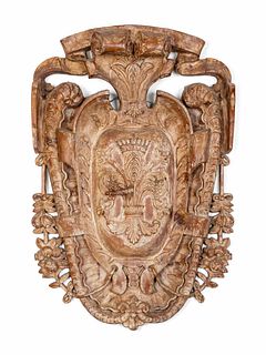 A Baroque Style Carved Wood Cartouche-Form Armorial Plaque
Height 39 x width 29 inches.