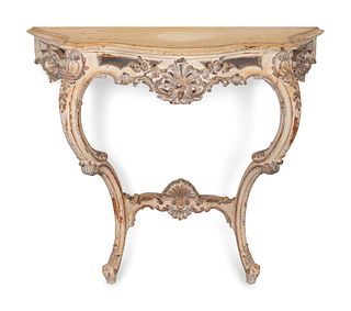 A Louis XV Style Carved and Painted Console
Height 35 x width 39 1/2 x depth 15 1/2 inches.