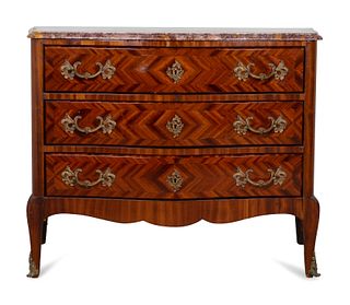 A Louis XV Style Gilt-Bronze-Mounted Tulipwood Commode
Height 34 x length 43 1/2 x depth 19 1/2 inches.