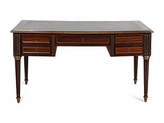 A Directoire Style Brass-Mounted Mahogany Bureau Plat
Height 29 3/4 x length 54 x depth 29 inches.