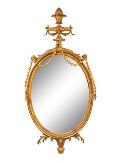 A George III Style Carved Giltwood Oval Mirror
Height 62 x width 30 inches.