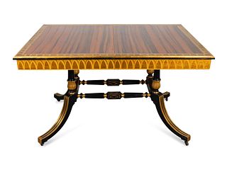 A Regency Style Macassar, Parcel-Gilt and Ebonized Library Table Height 32 x length 55 x depth 39 inches.