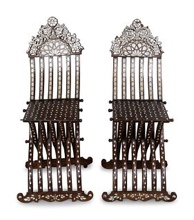 A Pair of Syrian Mother-of-Pearl-Inlaid X-Form Folding Chairs
Height 46 x width 14 inches.
