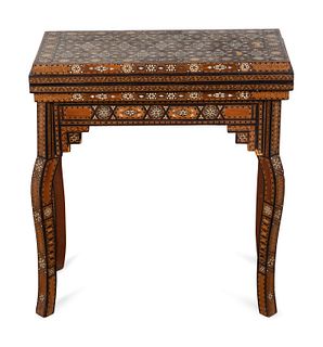 A Syrian Mother-of-Pearl and Bone Inlaid Games Table
Height 26 1/2 x width 24 x depth 12 inches