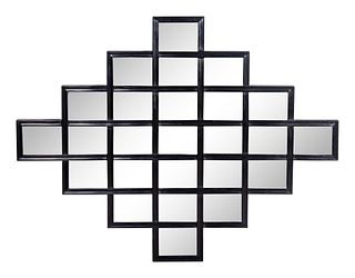A Contemporary Black Framed Mirror by Christopher Guy
Height 38 1/2 x width 49 1/4 inches.