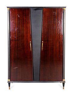 An Italian Bronze-Mounted Black Lacquer and Mahogany Wardrobe
Height 69 1/2 x width 48 1/2 x depth 14 1/2 inches.