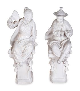 A Pair of Chinese Blanc de Chine Figures on Pedestals
Height of figures 21 and 22 inchesx width 14 inches; height of pedestals 39 1/2 inches.