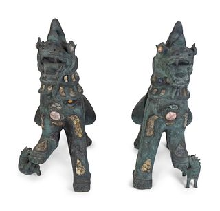 A Pair of Chinese Stone-Inset Bronze  Fu-Lions
Height 32 x length 24 x width 13 inches.