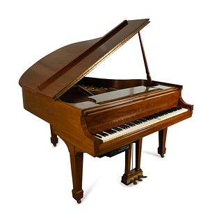 A Model M Steinway Walnut Cased Piano 
Height 37 1/2 x width 55 3/4 x length 66 inches.