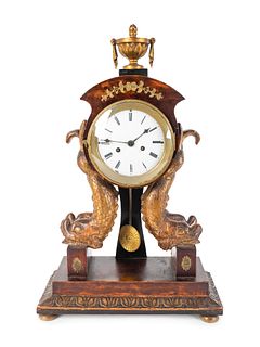 An Italian Empire Parcel-Gilt Walnut Mantel Clock
Height 17 1/2 x width 11 x depth 5 inches.