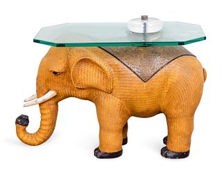 A Contemporary Rattan Elephant-Form Side Table
Height 16 1/2 x length 24 x width 13 inches.