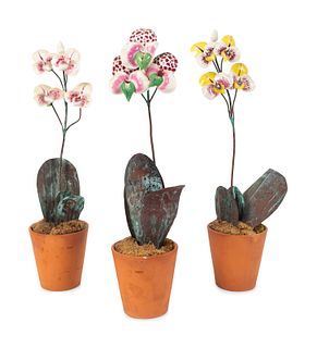 Three French Enameled Metal Potted Orchids
Heights 14 1/2 inches.