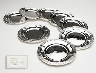 A set of eight sterling silver bread plates