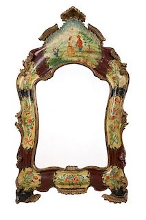 A Venetian carved and polychromed wall mirror