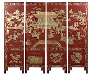 A Chinese four-panel relief-carved screen