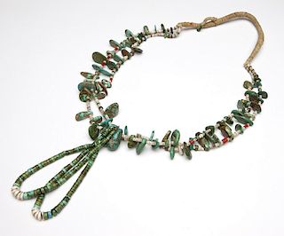 A Pueblo turquoise necklace with jacklas