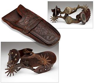 Two pairs of spurs and a tooled leather holster