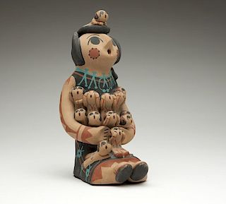 A Jemez Pueblo pottery storyteller figure